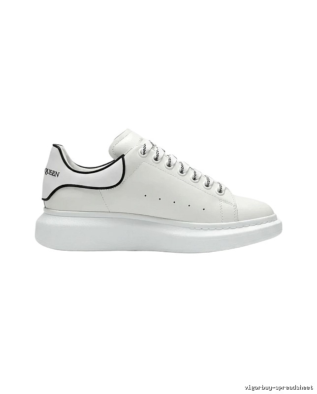 The minimalist style of McQueen white sneakers.