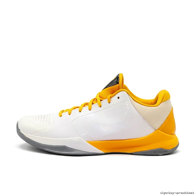 White and yellow color scheme of Nike basketball shoes